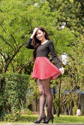 Beauty in red floral skirt and stockings